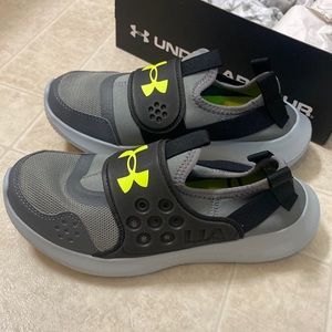 Under Armour sneaker. Boys Grade School Size 4. New in box.
